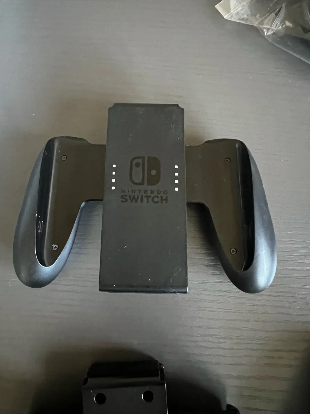 Nintendo Switch Joy-Con comfort grip and a black Joy-Con wrist strap. Used